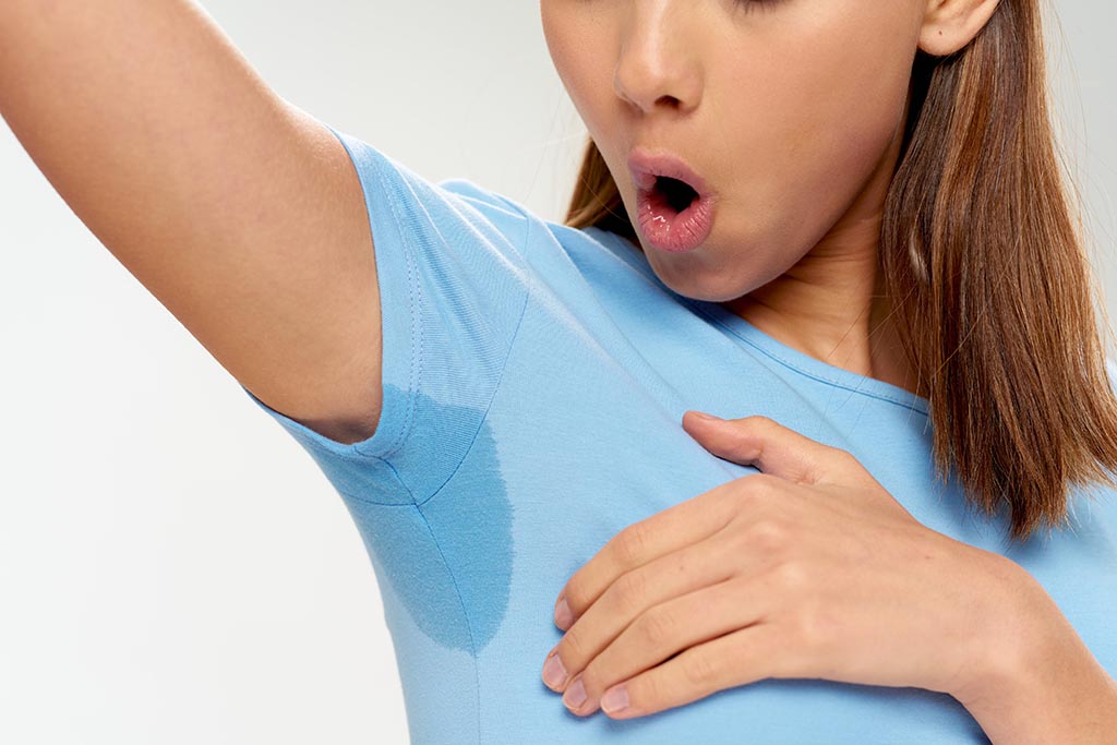 Woman sweaty armpits, hyperhidrosis